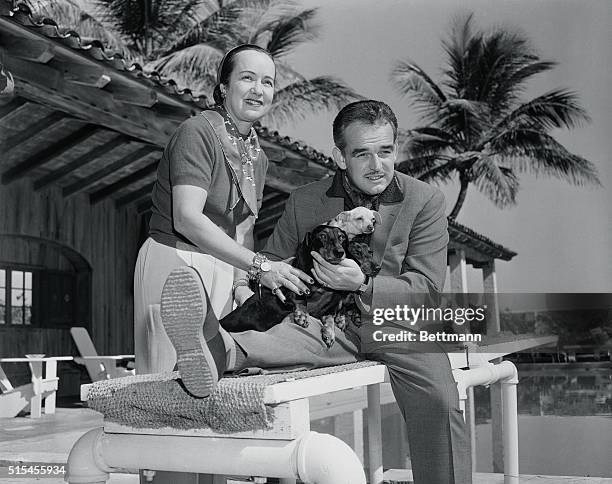 Prince Rainier of Monaco, whose fiancee, Grace Kelly, is in Hollywood making a film, enjoys a Florida vacation at the home of William Howard Bell...