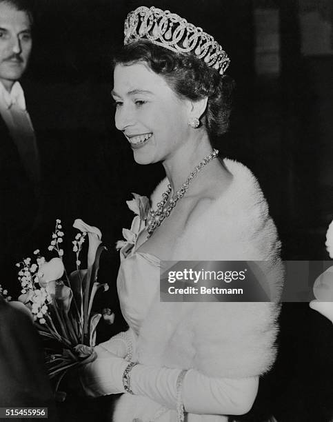 Queen Elizabeth arrives at London's Leicester Square Theatre, December 12th, to attend the premiere of Richard III, a benefit performance for King...