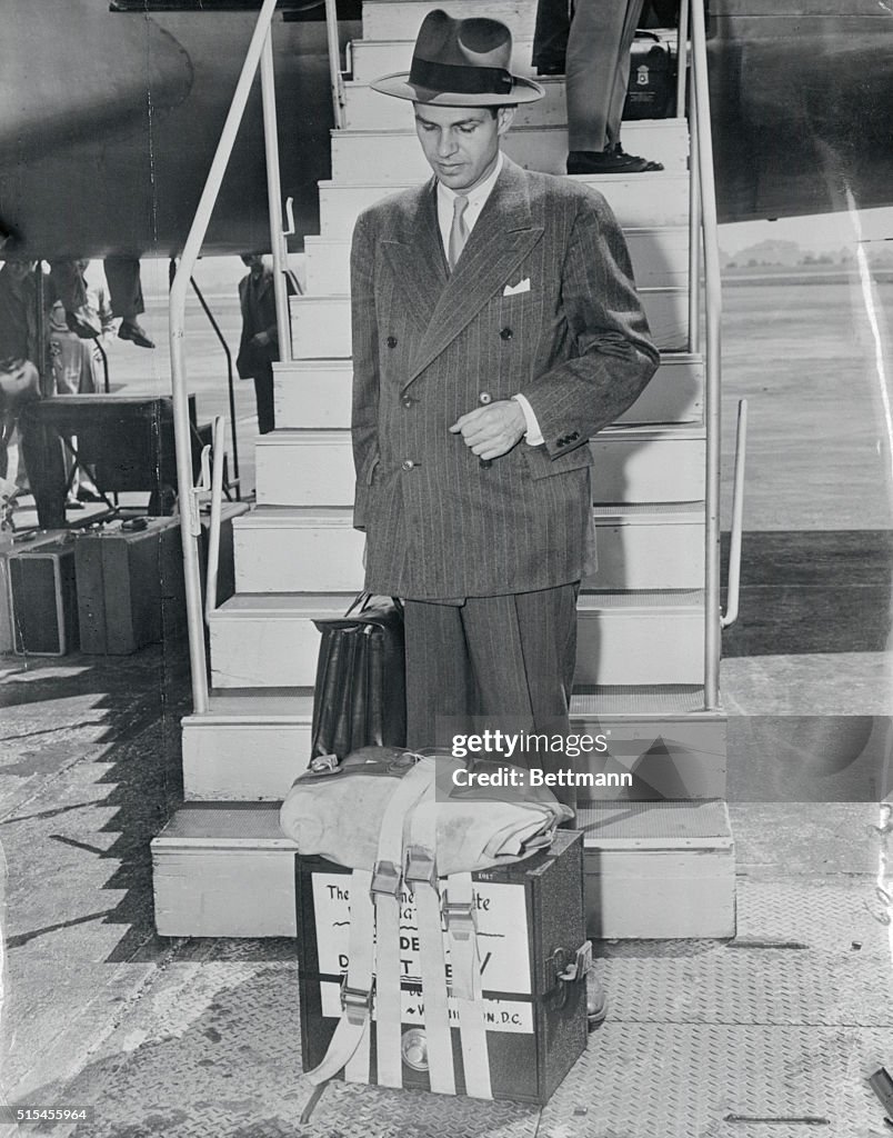 Alger Hiss Exiting Airplane with Case