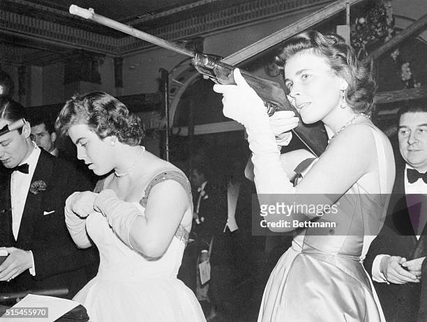 Princess Christina of Hesse adds to the sights as she sights in at the shooting range while attending the "London Ball:" at the Dorchester Hotel in...