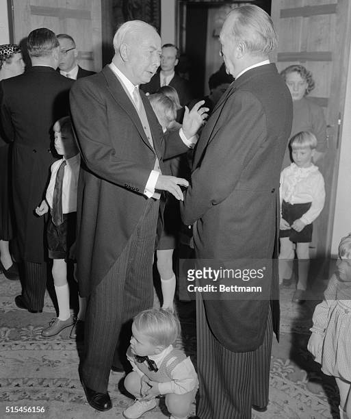 Little Stephan Wehrhahn , grandson of West German Chancellor Konrad Adenauer , is the middleman in a conversation between Adenauer and President...