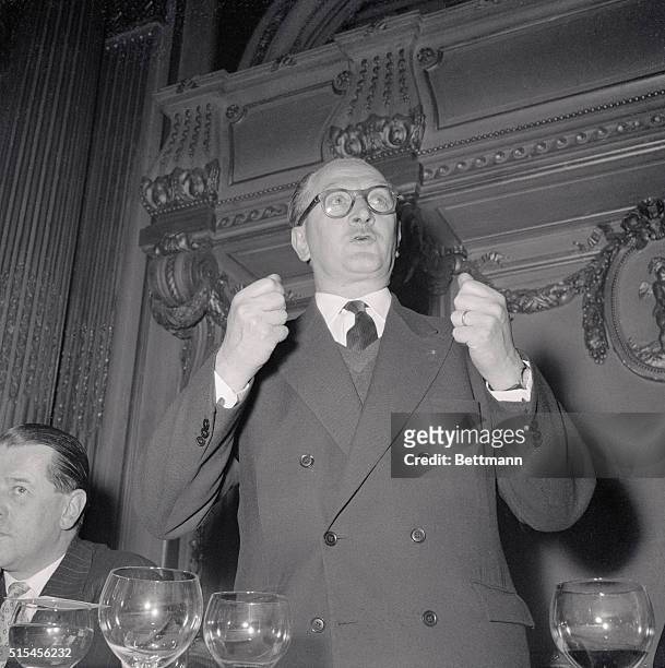 Guy Mollet, head of the French Socialist party which combined with Pierre Mendes-France's forces in the recent general election, addresses members of...