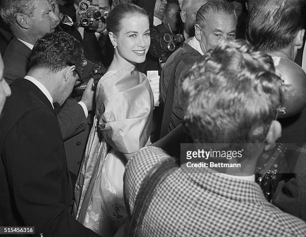 Grace Kelly Arrives For Academy Awards. Hollywood: Actress Grace Kelly smiles brightly as she arrives for the 28th Annual Academy Award presentations...
