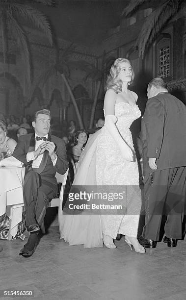 Actress Anita Ekberg walks up to receive her Henrietta award from the Hollywood foreign Press Association at Hollywood's Coconut Grove Feb. 23. She...