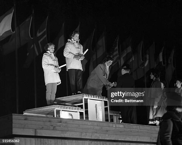 On the podium as medals are presented by Avery Brundage for victories in women's figure skating at the 1956 winter Olympics are from left to right,...