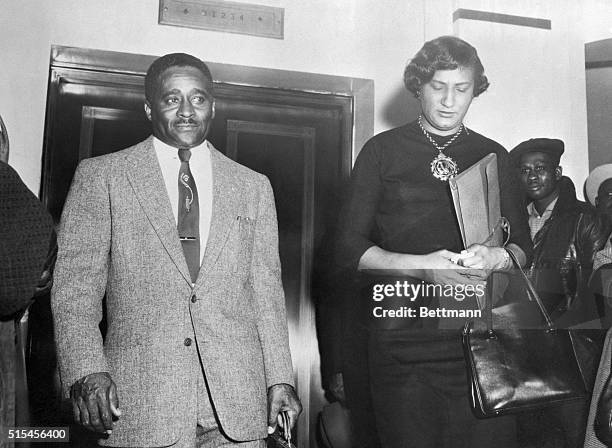 Attorneys Arthur Shores and Constance Motley, counsel for the NAACP, leave the federal courthouse in Birmingham, after a dismissal without prejudice...