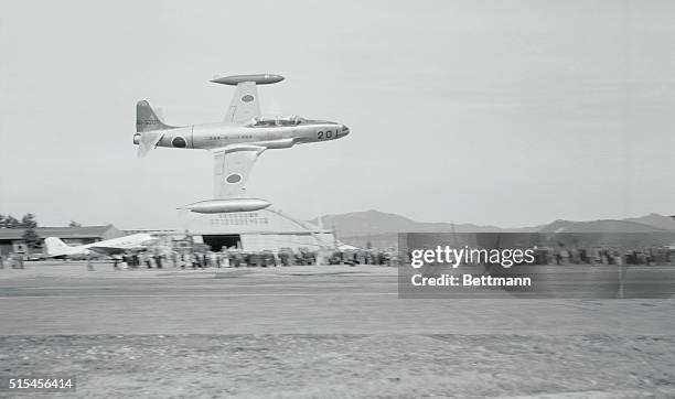 The Rising Sun emblem flies again over Japan, a few feet off the ground at Gifu, as a 33 jet trainer zooms along at about 400 m.p.h. The plane, the...