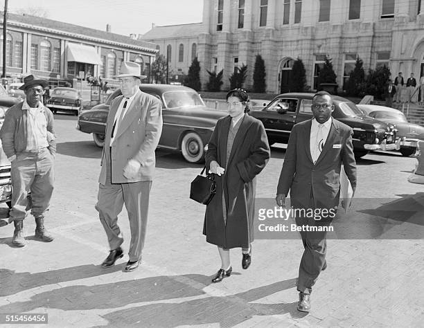 Rosa Parks , accompanied by her attorney, Charles D. Langford , and an unidentified deputy, is on her way to jail- arrested on charges of violating...
