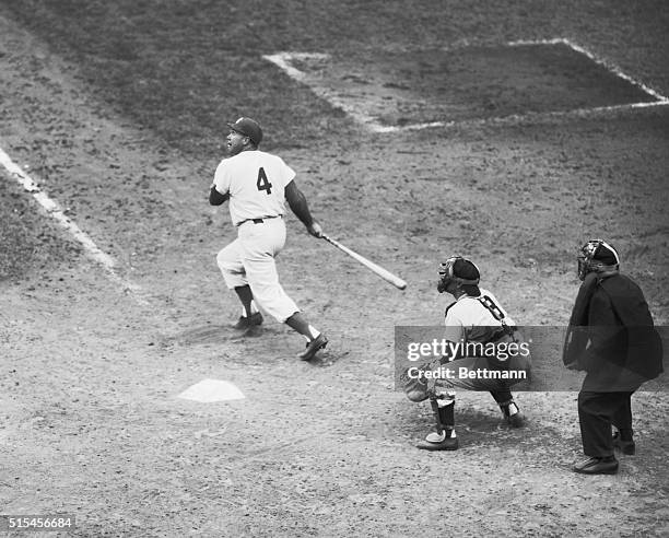 Duke Snider, Dodgers, doubles to left field in 7th inning of fifth game of the World Series. Berra is the catcher and Bill Summers is the umpire.