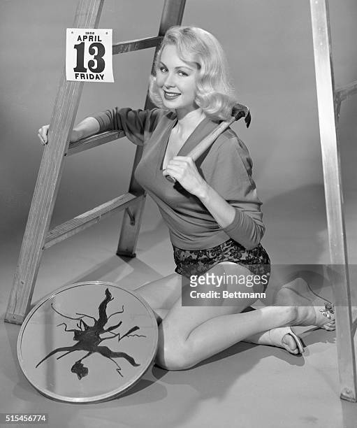 Hoodoos, jinxes, and superstitions apparently mean very little to television actress Joi Lansing. Not content with tempting the fates by breaking a...