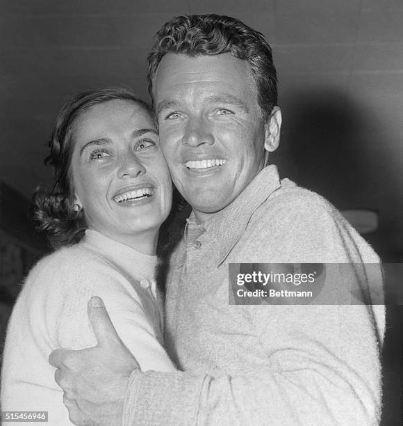 With tears of joy in her eyes, Ielene Burke, wife of golfer Jackie Burke, Jr., congratulates her husband after his come-from-behind victory in the...