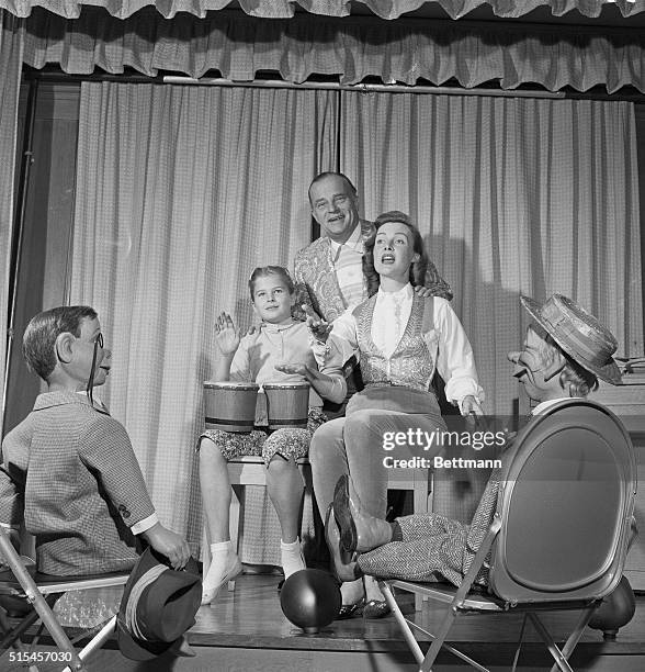 Charlie McCarthy , introduced as producer of the show, sits with friend Mortimer Snerd of Bergen, Bergen, and Bergen, performed on a small stage in...