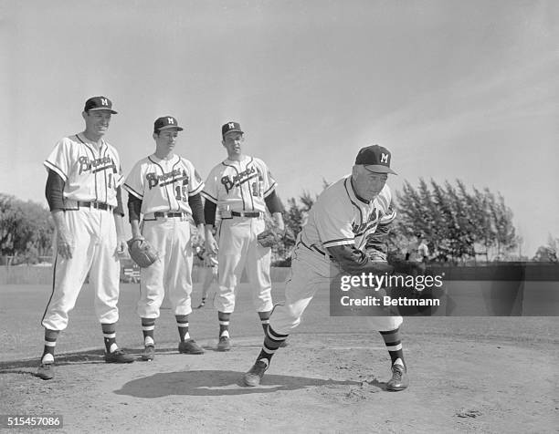 New pitching coach for the Milwaukee Braves is Charley Root , who starred on the mound for the Chicago Cubs a generation ago. Looking on while Root...