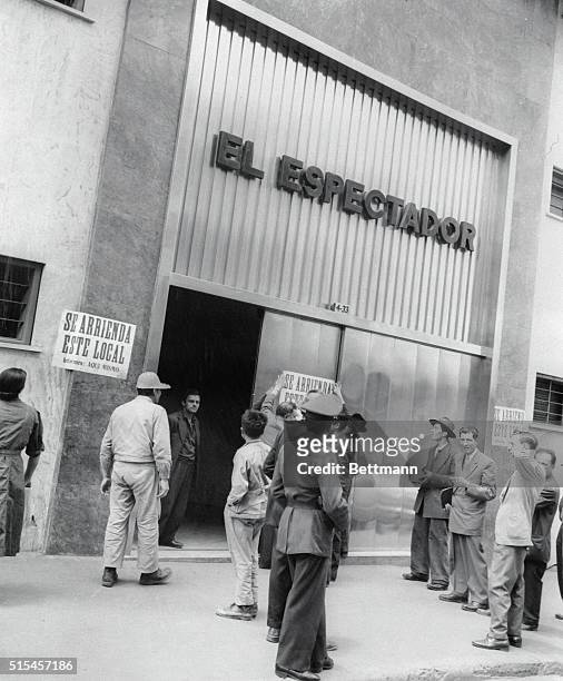 Employees of El Espectador post notices on the door of the newspaper office when owners decided to rent offices of the publication after the shutdown...