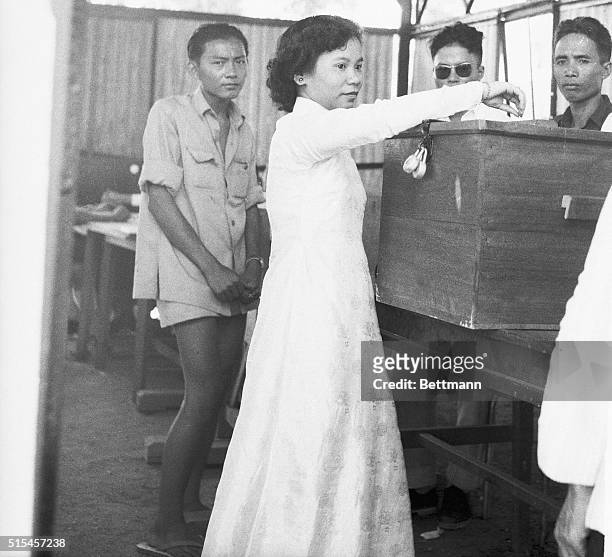 This young South Vietnamese woman casts her ballot during the general elections held in the area to name a Constitutive Assembly. South Vietnam,...