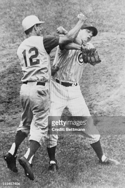 Chicago: Cincinnati's Billy Martin walked out to the pitcher's mound to greet Cub's pitcher Jim Brewer with a right to the eye in game here. Martin...