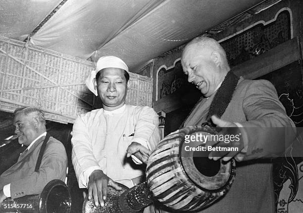 With Burmese defense minister U Bashwe instructing, Nikita Khrushchev, head of Russia's Communist Party and Star salesman for communism, tries his...