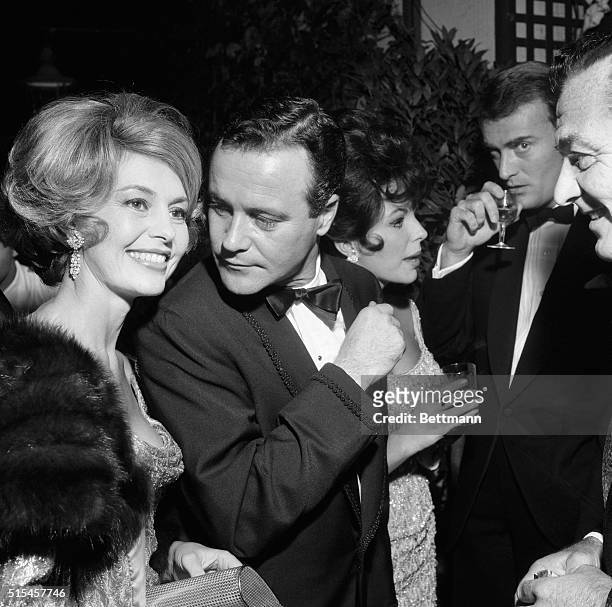 Hollywood stars Cyd Charisse , Jack Lemmon and Joan Collins enjoy themselves during a party at the Grand Hotel in Rome, October 14th. The huge party,...
