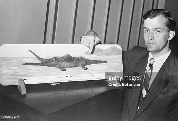 London: Says He Filmed Loch Ness "Monster." Former Royal Air Force pilot Tom Dinsdale displays a model he made of the storied Loch Ness "Monster."...