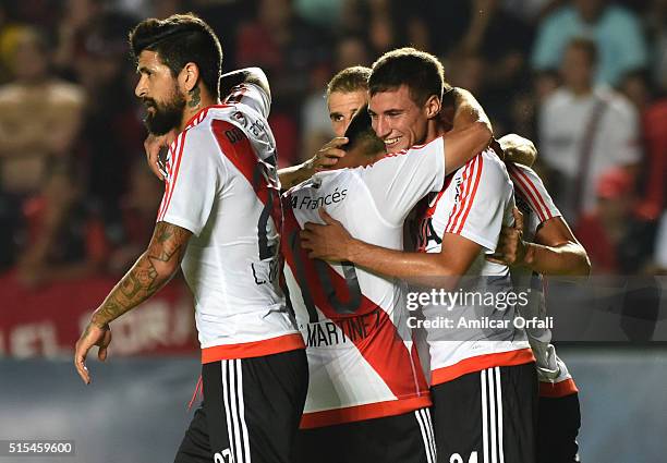 Emanuel Mammana celebrates with teammates after scoring the opening goal during a match between Colon and River Plate as part of Torneo de Transicion...