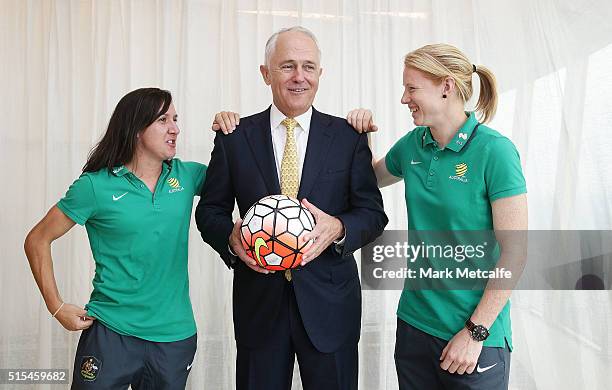 Australian Prime Minister Malcolm Turnbull Tunbull poses with Matildas co-captains Lisa De Vanna and Clare Polkinghorne during a welcome home...