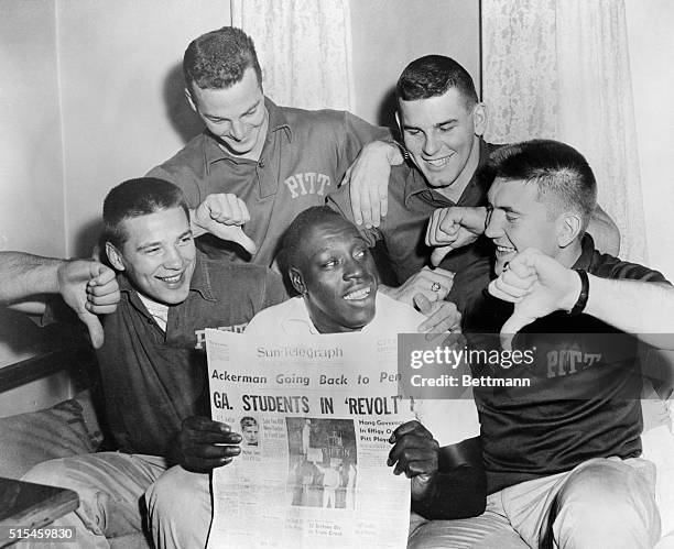 Teammates show Bobby Grier, , what they think of Georgia Governor Marvin Griffin's threat to block Georgia Tech from playing in the Sugar Bowl on...