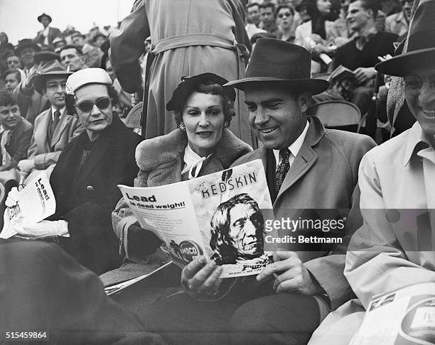Vice President and Mrs. Richard M. Nixon were among the 30,000 fans who watched the Washington Redskins play the New York Giants at Griffith Stadium...