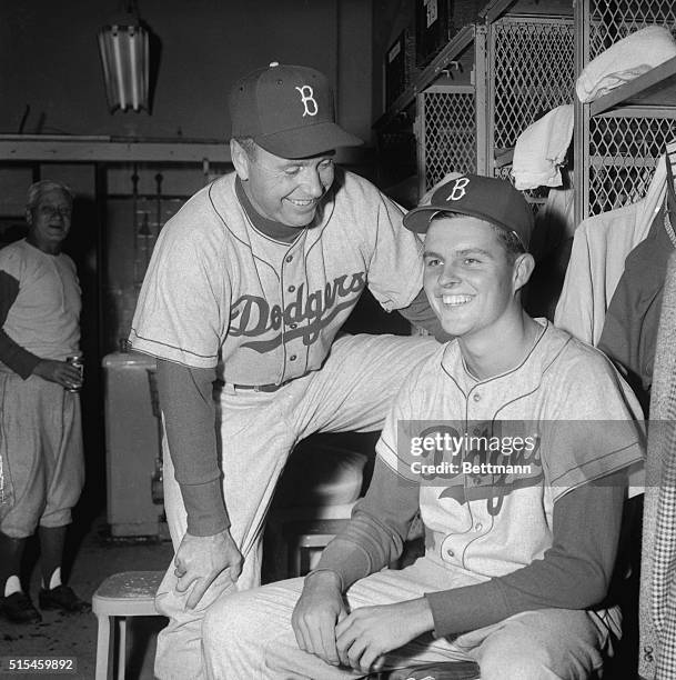 Dodgers manager Walt Alston enjoys a victory smile with 19-year-old rookie pitcher Don Drysdale after the young right-hander won his first major...