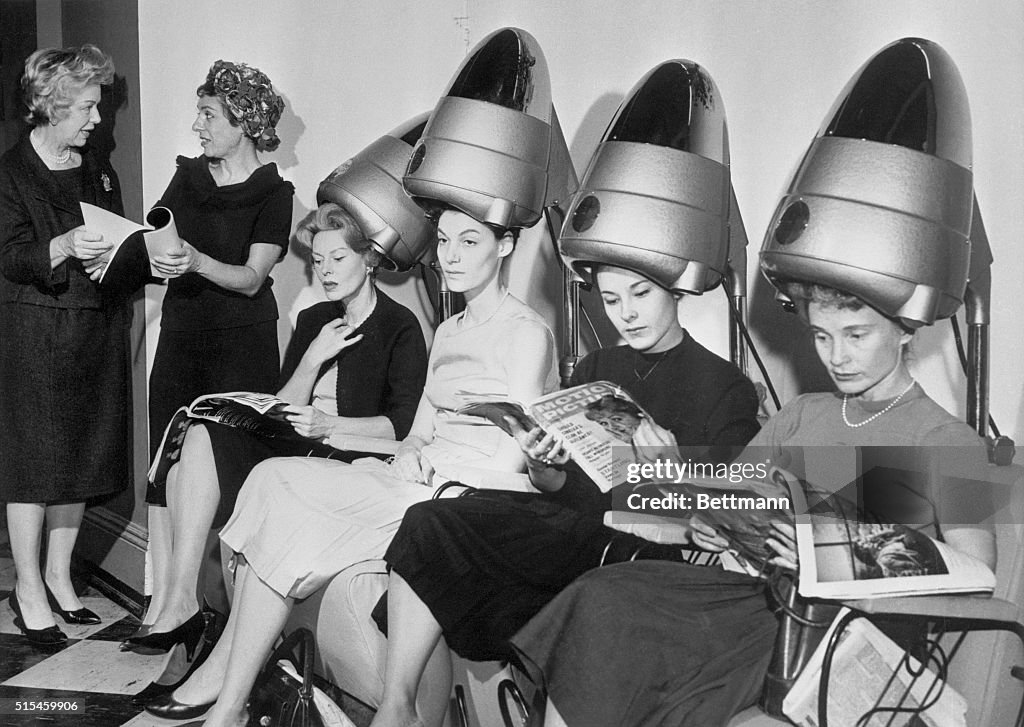 Women Sitting Under Hair Dryers in Television Show