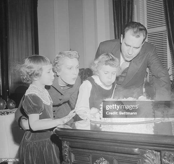 Vice President Richard Nixon's daughters, Julie and 'Tricia team up with Mom and Dad to create the big blow that doused the candles on the "Veep's"...