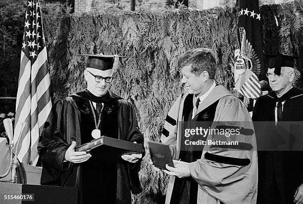 November 11 Seattle, Washington: President Kennedy receives a book commemorating the first 100 years of the University of Washington here 11/16 from...