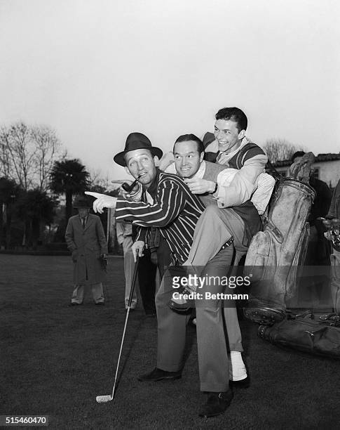 Lest the two crooners, Crosby and Sinatra, come to blows as they vie for the amateur trophy, Bob Hope sandwiches himself between them to keep peace....
