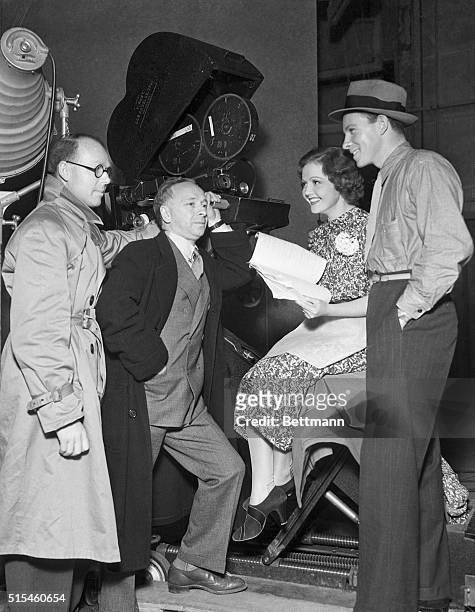 When not emoting, stars and directors often go into a confab concerning the story. Left to right, co-director Al Kelly, director Leo Bulgakov, Nancy...