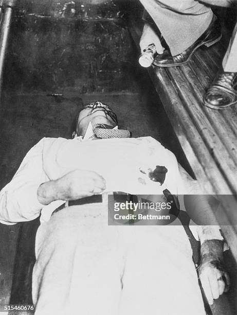 Chicago. Dillinger's End!!! They had to kill John Dillinger to get him. Here he lies in a police patrol wagon after three bullets, fired by Federal...