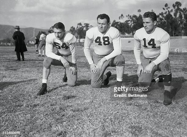 Left to right Dixie Howell, half-back; Captain Bill Lee, tackle; and Don Huston, end, all of the University of Alabama's Rose Bowl team. They were...