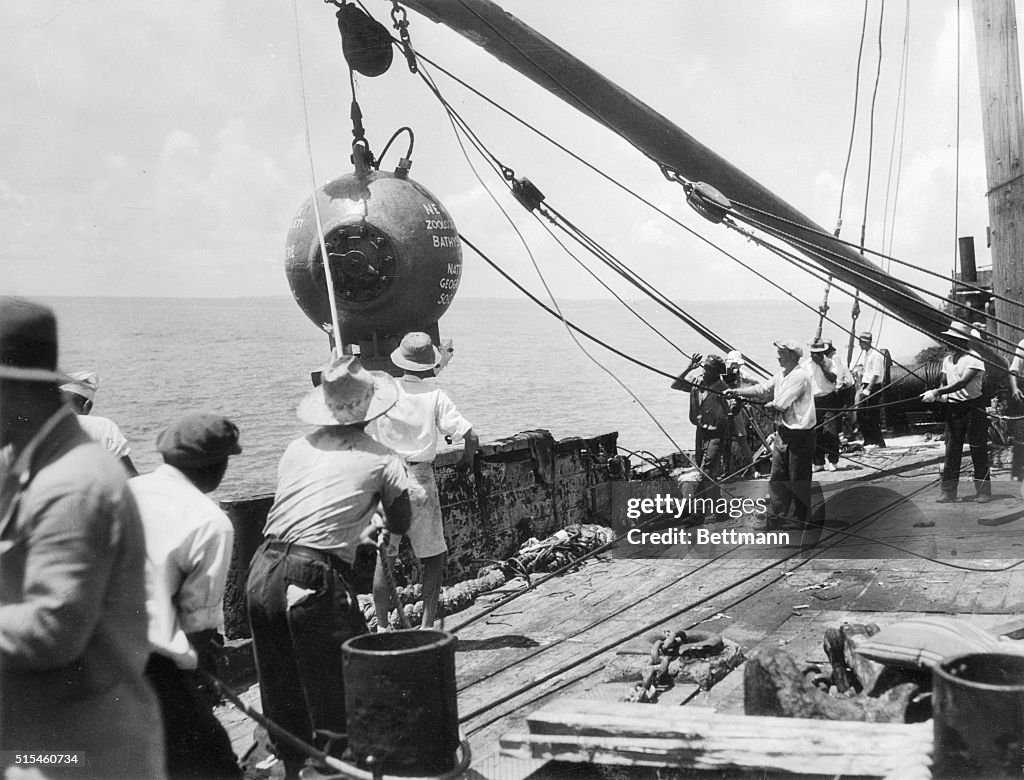 Dr. William Beebe on Barge with Crew