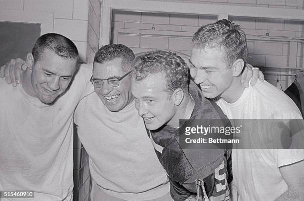 This happy foursome of Green Bay Packers are shown in dressing room after winning the Western Division Championship by defeating the New York Giants...