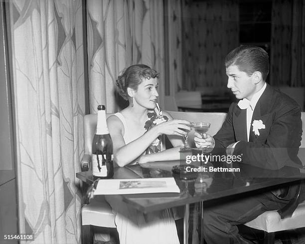 Mr. And Mrs. Sanders Draper, Park Avenue Society Leaders, attend the opening of the Rainbow Room atop the 65th floor of the RCA building at Radio...