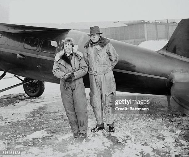 Amelia Earhart and her husband George Palmer Putnam, after arrival at Newark Airport from the West Coast. Their cross-continent flight was made in...