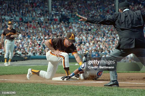 Action of Chicago Cubs vs. Padres, National League Playoffs. Bob Dernier Chicago Cubs outfielder is safe at first on pickoff attempt by Thurmond....