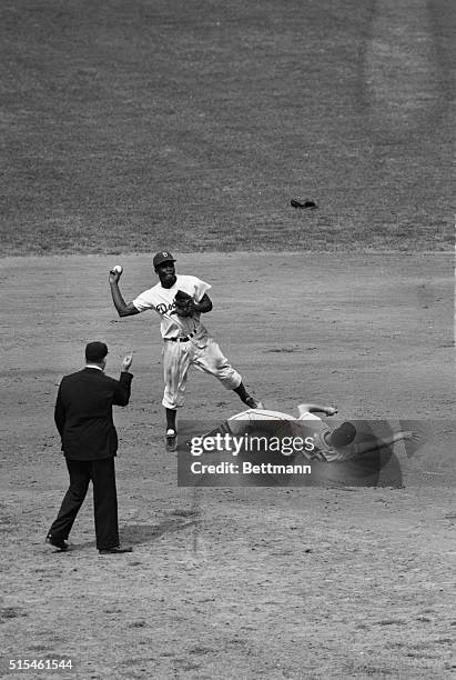 Don Mueller, of the Giants, is forced at second in fourth inning of game between Giants and Dodgers. Billy Cox fielded Walker Cooper's grounder,...