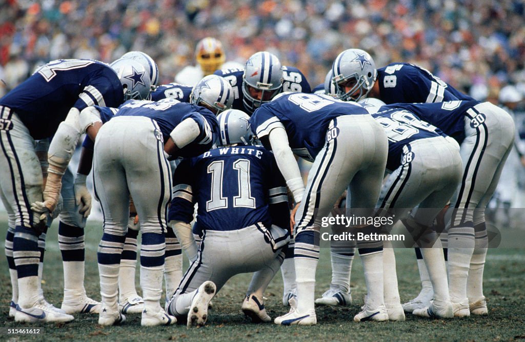 Danny White Calling Signals in Huddle