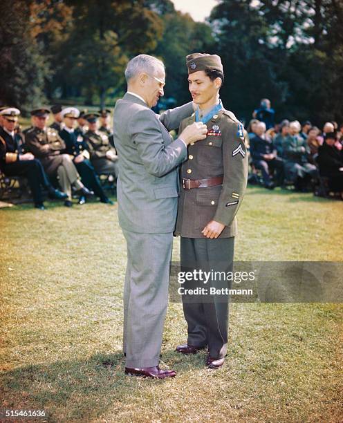 President Truman awarding Congressional Medal of Honor to Corporal Desmond Doss of Lynchburg, Va., a conscientious objector who served in Medical...