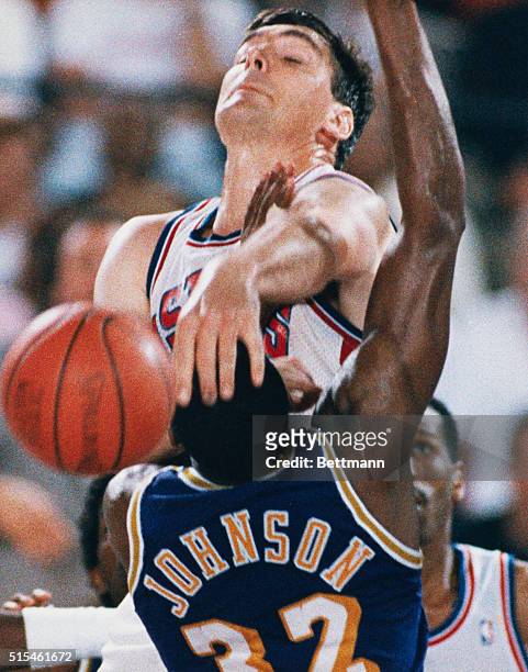 Pontiac, Michigan: Detroit Pistons' Bill Laimbeer blocks a shot by Los Angeles Lakers' Magic Johnson during the fourth quarter of their game, June 16.