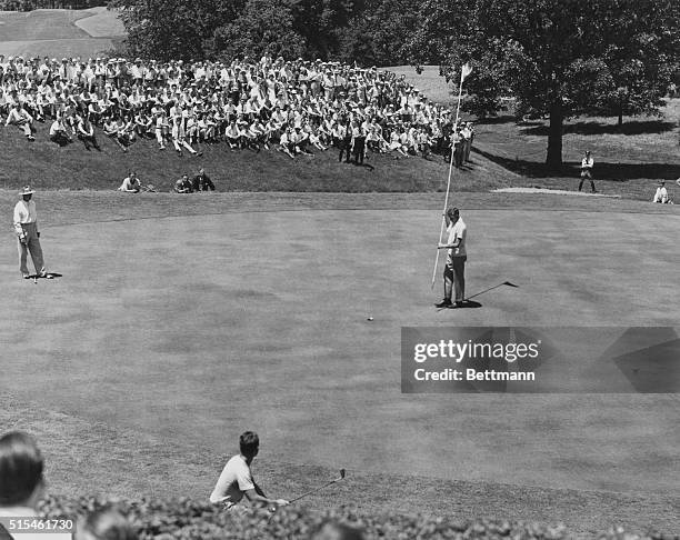 St. Louis, Missouri: Scene at 18th Green, Of National Open Golf Championship between Snead And Worsham. Lew Worsham, foreground, makes beautiful chip...