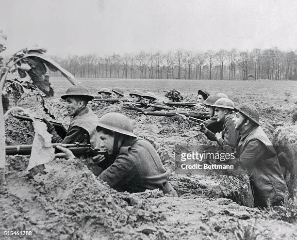 Fighting on the banks of the Maas near Venlo, this British infantry unit fights from a trench that is reminiscent of World War I. The tommies are...