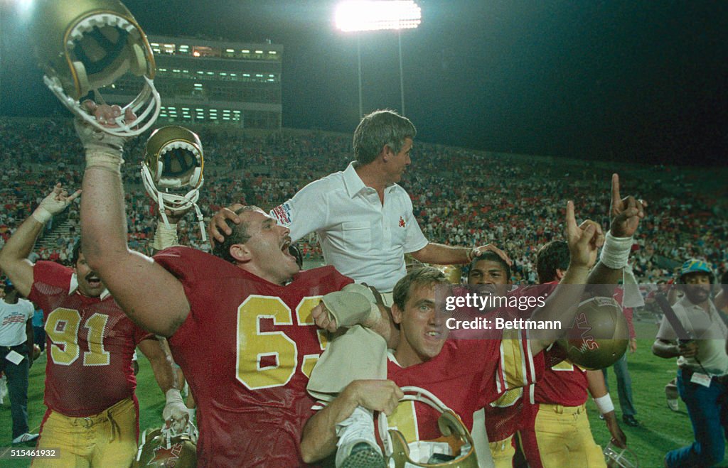 Teammates Carrying Coach Jim Mora on Shoulders