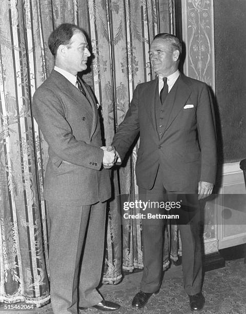 Olympic Committee Chairman Avery Brundage and Amateur Athletic Union President Jeremiah Mahoney shake hands prior to the annual three-day convention...