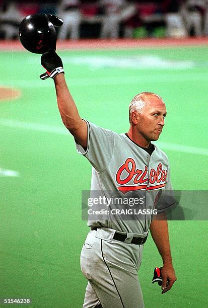 Baltimore Orioles' Cal Ripken, Jr., acknowledges a standing ovation from the crowd after hitting his 3000th career hit in the seventh inning against...