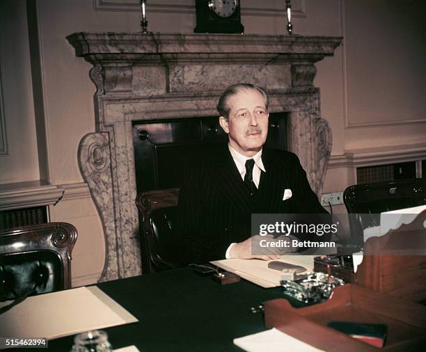 Harold MacMillan, the new Prime Minister of England, is shown at his office on 10 Downing Street.